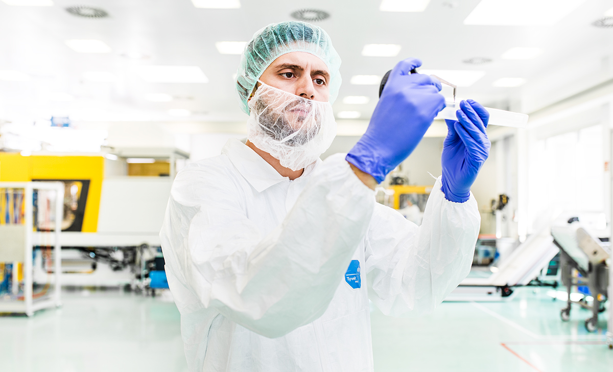 cleanroom worker at rose plastic medical packaging.